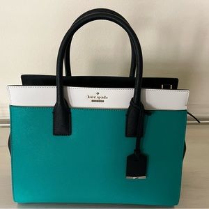 Kate Spade top handle bag in turquoise, black and white color block.